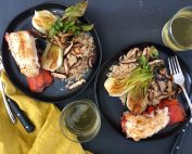 A plate of food with rice meat and vegetables